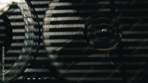 Tape audio music player, VHS studio magnetic tape, vintage retro spool reel to reel player and recorder, magnetic tape data storage close up, music studio.
