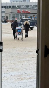 Woman and man seen leaving Walmart through an emergency exit with unpaid groceries. | Yegscoop