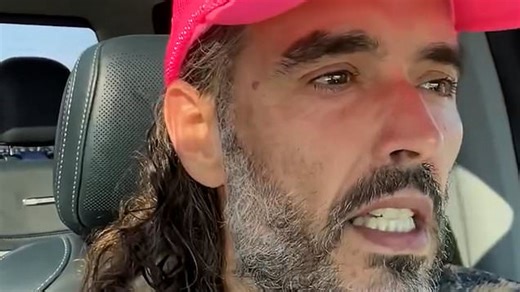 Russell Brand releases video denouncing 'attacks' on him after being charged with rape