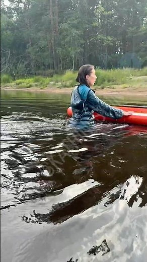Sup board Beauty Lady catsuit shiny nylon Hunter boots taking swim fully clothed wetlook soaked