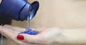 Woman pouring shower gel in bath 4k movie. Morning hygiene concept