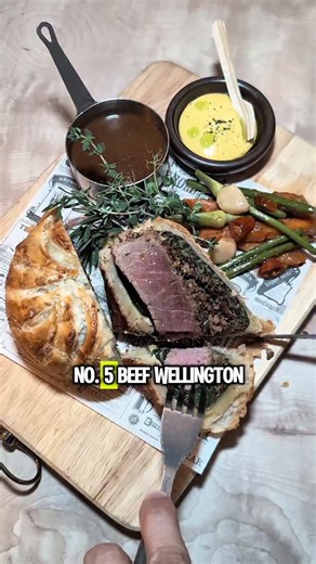 PenangToday | news | food | events | travel | lifestyle on Instagram: "7 Christmas dishes that'll make you the most popular person in your group chat 🎄🔥 White Smoke just dropped their Christmas menu and Penang foodies are losing it: 1️⃣ Kuih Pie Tee (roasted pork + spicy mayo fusion) 2️⃣ Squid (fermented chilli oil hits different) 3️⃣ Paella Valenciana (smoked iberico bacon heaven) 4️⃣ Homemade Porchetta (crispy skin perfection) 5️⃣ Beef Wellington (mushroom duxelle goals) 6️⃣ Berries & Pistac