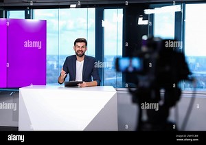 Presenter and video camera operator working in studio. News broadcasting Stock Photo - Alamy