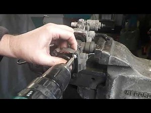 Land Rover Hitachi or Dunlop Air suspension air compressor Exhaust Valve Removal