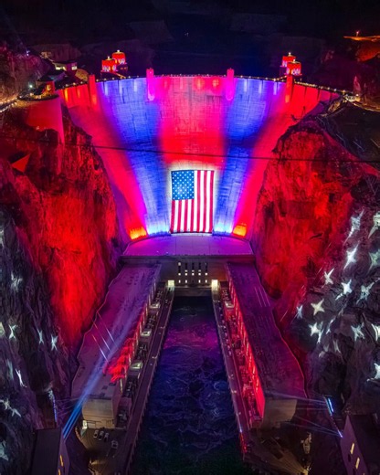A football-field-sized American flag and a red, white, and blue light display were unveiled at the Hoover Dam as part of celebrations marking America’s 250th anniversary.