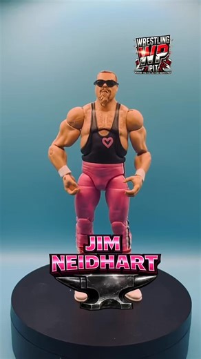 Jim Neidhart, known to WWE fans as “The Anvil,” was one of professional wrestling’s most powerful and charismatic tag team competitors of the 1980s and 1990s. With his trademark goatee, booming laugh, and explosive in-ring style, Neidhart brought raw strength and intensity to every match. As one-half of The Hart Foundation alongside Bret “Hitman” Hart, he captured multiple WWF Tag Team Championships and became a cornerstone of one of wrestling’s most respected families. A former football player 
