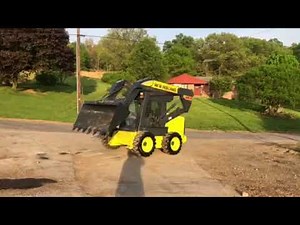 New holland Ls 185.b skidsteer loader backhoe