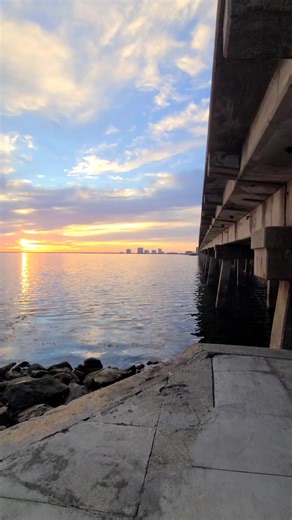 Gorgeous morning waters and golden sun under the Bob Sikes Fishing Bridge 🌅 A calm moment where light dances on the bay and the day begins in peace. Follow for more beautiful Florida mornings. #BobSikesBridge #PensacolaBeach #MorningWaters #GoldenSun #CoastalCalm
