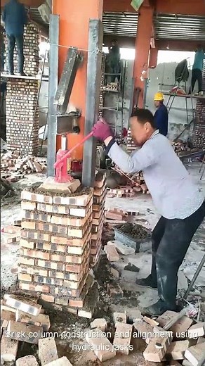 Brick column construction and alignment using hydraulic jacks