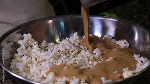 cooking popcorn at home in a special machine caramel. filling caramelized popcorn recipe close-up delicious treat for movie
