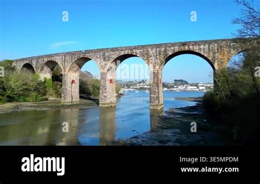 Saltash, Cornwall, England: DRONE VIEWS: The drone flies through the arches of Coombe Viaduct which carries the mainline railway from Plymouth via Saltash to Penzance, Cornwall. The River Tamar is the main transport link between Devon and Cornwall Stock Video Footage - Alamy
