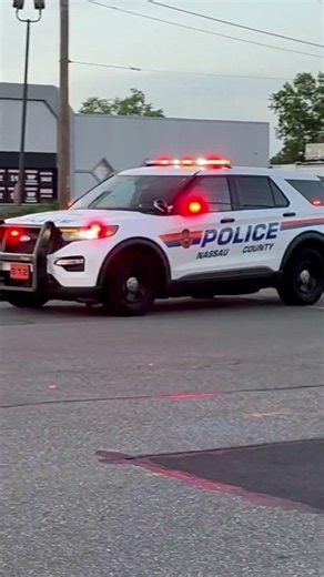 Nassau County police cars leaving a car fire on 6/24/26