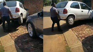 Strongman gets frustrated, squats and picks whole car up to move it out his way