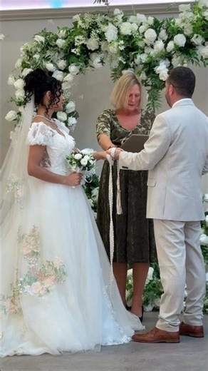 Hand fasting ritual at a sage and olive green ceremony