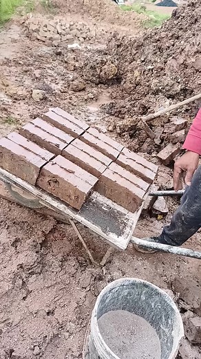 Manual Brick Pressing Techniques at Construction Sites