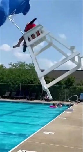Wind Pulls Lifeguard Chair Into The Pool