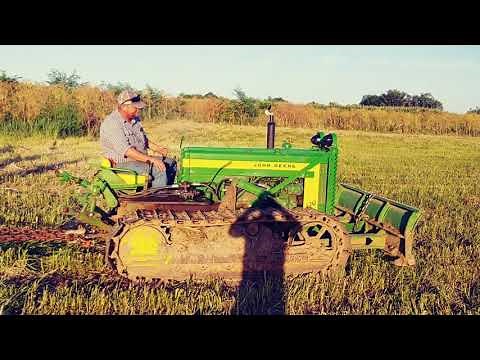 John Deere 420C Pulls 10 Bottom Plow
