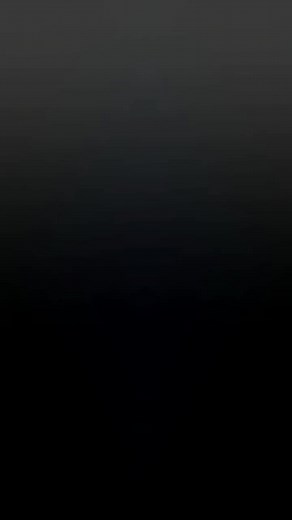 Elegant Woman in Red Dress Walking Outdoors