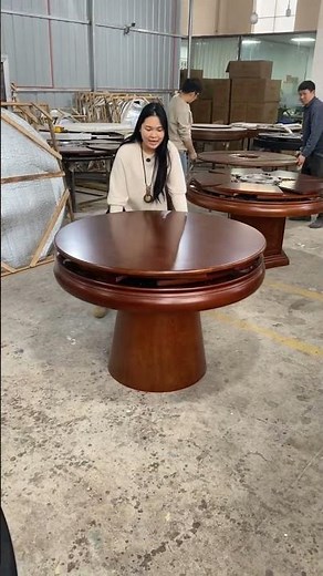 features a modern wooden round dining table with a built-in rotating Lazy Susan mechanism.ok