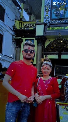 Cultural Moments Captured: Man and Woman at Iconic Building