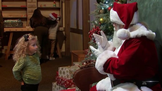 Santa Claus spreading holiday cheer to deaf children using sign language