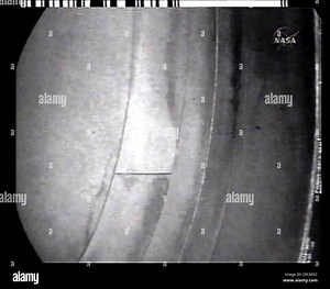 In this image from NASA Television a camera mounted on Space Shuttle Discovery's robotic arm is used for the final inspection of the heat shield tiles of the nose cap, Wednesday, Dec. 20, 2006. (AP Photo/NASA TV Stock Photo - Alamy