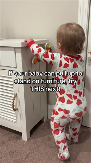 Pulling up to stand is an exciting milestone most babies begin exploring around 8–10 months. At first, this usually happens against furniture like a couch, coffee table, or crib rail. That support lets babies use their arms to pull themselves up while they’re still building strength in their legs and core. As babies get stronger, the next progression is working toward a more vertical pull to stand. This encourages them to push through their legs, activate their glutes, and develop trunk control,