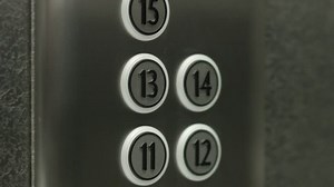 clip-10528121-man-presses-button-thirteenth-floor-elevator