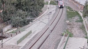 commuter train leaving the passenger station, 4k 50fps video