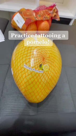 Just a girl learning how to tattoo on a pomelo. #yegtattoo #tattooapprentice #tattooartist #edmontontattoo #fruittattoo