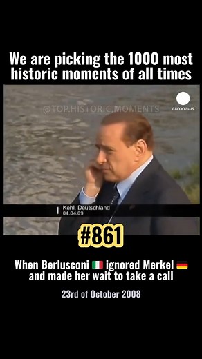 On the 23rd of October 2008, during a NATO summit press conference in Brussels, Italian Prime Minister Silvio Berlusconi took a lengthy phone call on stage, leaving German Chancellor Angela Merkel standing awkwardly beside him. Merkel, waiting to speak next, folded her arms and stared ahead while Berlusconi chatted casually for several minutes. Merkel later laughed it off, but the clip cemented Berlusconi’s reputation for treating protocol lightly. The summit itself was about Afghanistan and Rus