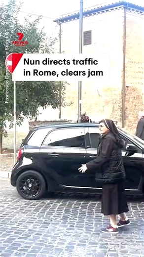 78K views · 747 reactions | A nun has gone viral online for helping clear a traffic jam near the Colosseum in Rome. A bus became stuck while trying to get around an illegally parked car before she jumped into action and directed vehicles around it. #nun #colosseum #rome #italy #trafficjam | 7NEWS Sydney | Facebook