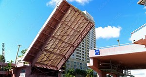 Drawbridge elevating and opening the space for boat traffic in Fort Lauderdale, Florida, 4K