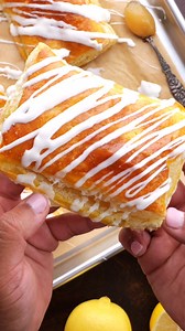 🍋Lemon Cheesecake Hand Pies feature a cheesecake and lemon curd filling all wrapped up in puff pastry, drizzled with a simple sweet glaze! It’s a summery dessert recipe that’s easy to make in about 30 minutes. #lemonpie #lemoncurd #handpies #puffpastry #puffpastryrecipe #lemondessert #lemondesserts #willcookforsmiles https://www.willcookforsmiles.com/lemon-cheesecake-hand-pies/ | Will Cook For Smiles