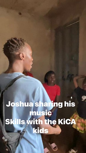 Joshua sharing his music skills with KiCA kids. | Kibera Creative Arts