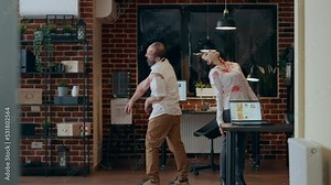 Crippled scary brain dead zombies with bloody scars wandering around office. Mindless brain-eating evil looking monsters with deep wounds roaming around agency workspace while growling.