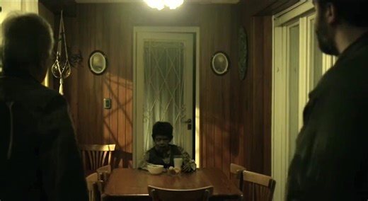 Terrified (Aterrados) (2017)Directed by Demián RugnaThe kitchen table scene is widely considered one of the film's most haunting, "legendary" moments. It involves a recently deceased young boy, Matias, who returns from the cemetery to his home, appearing as a decrepit corpse sitting at the table.