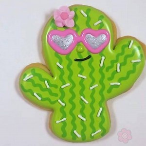 64K views · 1.4K reactions | I made these cookies for a really ‘Cool Cactus’ using the @sugarbelle cutter! Watch the video and learn how to use a royal icing transfer to create the heart sunglasses! Plus, use tip #129 to make a quick and easy and CUTE drop flower! Check out the full tutorial on today's NEW blog post on www.flourboxbakery.com #cactus #coolcactus #cutecactus #cactuscookies # #cookiedecorating #sugarcookies #cookieart #decoratedcookies | The Flour Box | Facebook