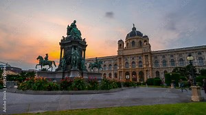 Beautiful view of famous Naturhistorisches Museum (Natural History Museum) with park and sculpture timelapse hyperlapse in Vienna, Austria. Warm light at evening