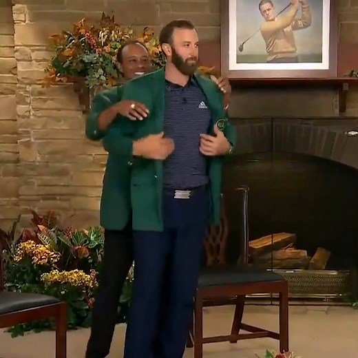What a moment. Tiger Woods places the green jacket on Dustin Johnson after DJ's victory at the Masters Tournament ⛳️ | SportsCenter