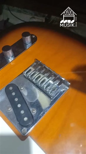 Restringing a Squier Telecaster electric guitar