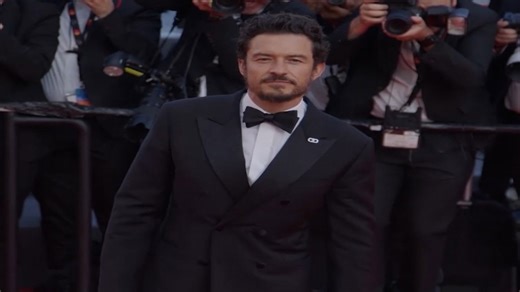 Orlando Bloom walks the Cannes Film Festival red carpet