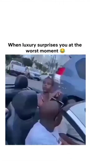 The post shares a 27-second video clip of a woman in a zebra-print top panicking in a moving convertible as its roof unexpectedly retracts, yelling