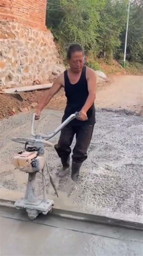 Manual cement mixture leveling process for smooth surface finish #concretework #construction