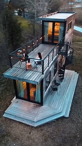 Inside “The Helm” – A Two-Story Luxury Container Home Meet “The Helm” — a two-story container home that breaks every tiny home stereotype. 🚢 Thoughtfully designed for comfort, style, and efficient living, this unique build pairs a 40-ft container with a 20-ft upper level to create an elevated (literally) experience. 🛏️ Main floor: cozy bedroom, sleek kitchen, open-concept living 🧼 Upstairs: serene master suite with full bath access to a private deck ✨ Details: quartz countertops, smart storag