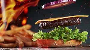 Beef Burger Ingredients Falling and Landing in the Bun