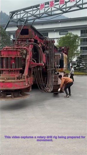 Rotary Drill Rig Moving: Workers Using Cardboard Under Tracks for Equipment Relocation