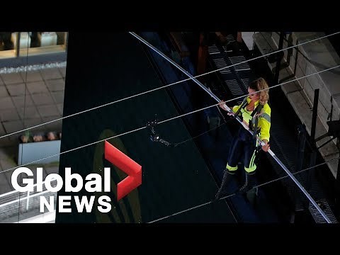 Flying Wallendas cross Times Square on high wire 25 stories high