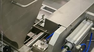 Food factory automated robotic production machine. Conveyor product line for cooking and packing rations and foods. Robotics and automatic lines used instead of human labor on factories and plants.