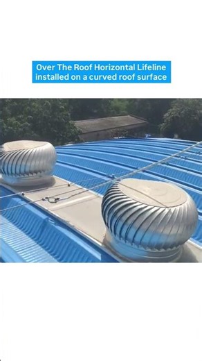 Over the roof horizontal lifeline installed on a curved roof